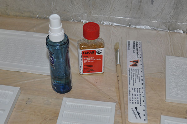 Netzmittel und Lineal zum Abstreifen